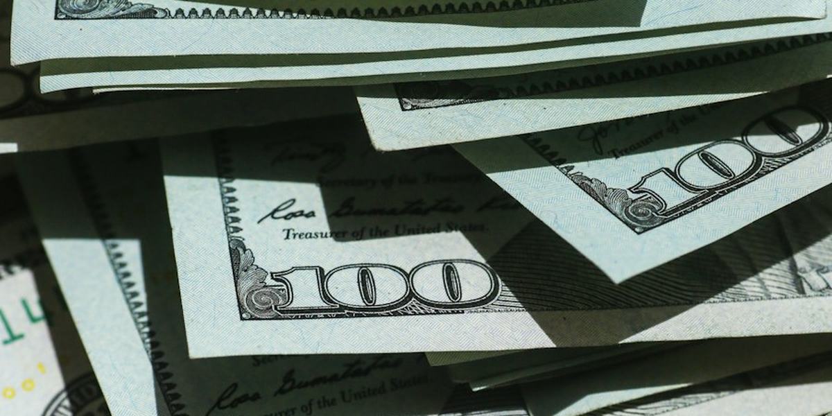 A pile of United States hundred dollar bills